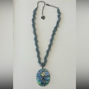 Abalone shell with beads necklace. Heart clasp